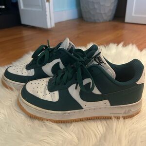 Custom Nike Air Force 1s low white and dark green sneakers with golden soles!